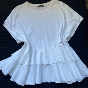 Zara white short-sleeved t-shirt with tiered ruffles.